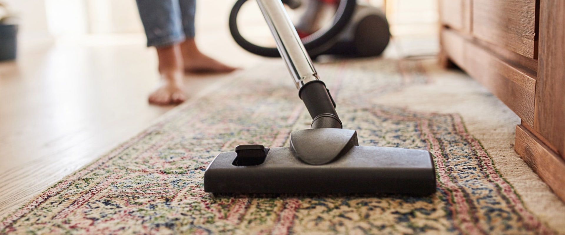 What is the best way to vacuum carpets and rugs?