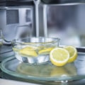 Is lemon or vinegar better for cleaning microwave?